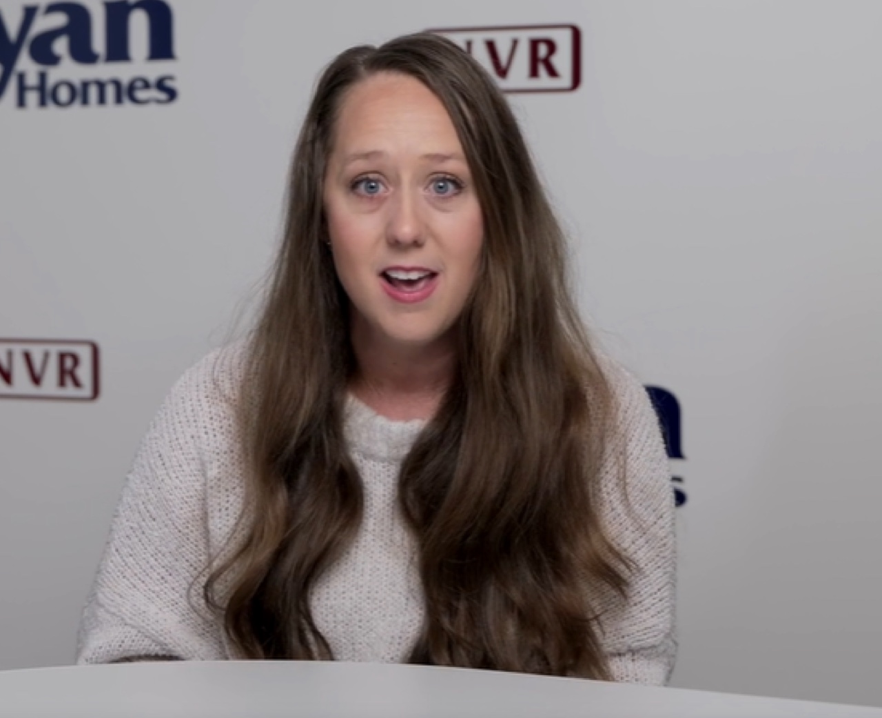 Smiling employee giving a testimonial.